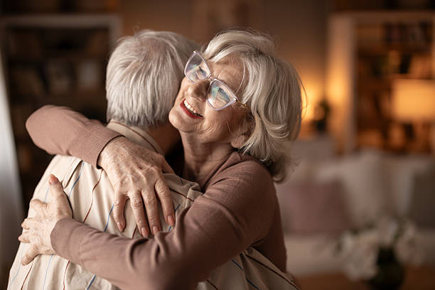 istock Tender Hug Between Elderly Couple In Warm Home Setting, Happiness And Comfort 2252269221