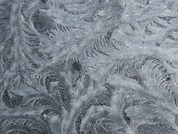 istock Frost has created beautiful, delicate patterns on a dark surface in the early morning light 2252269968