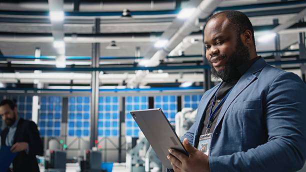 istock Black industry specialist examines production data in a solar tech facility 2252272345