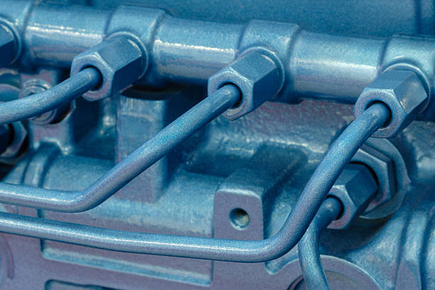 Shown is a large engine with many tubes, bolts and various parts. Auto service concept background.