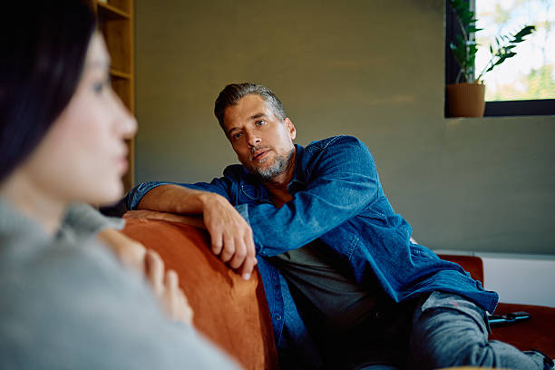 istock Man looking at woman during serious discussion 2252277149