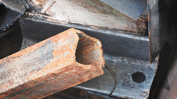 istock A rusty metal pipe with a hole in it. The hole is large and the pipe is bent 2252277351