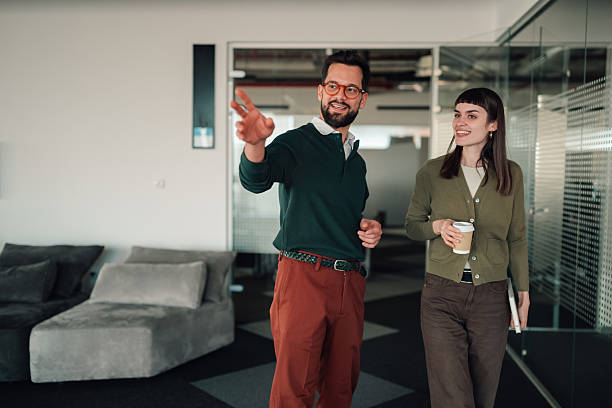 istock Business colleagues talking walking discussing new projects in modern office 2252278239