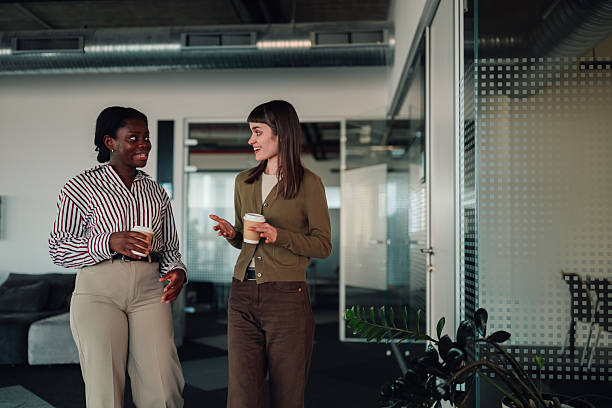 istock Diverse women colleagues chatting during coffee break in office 2252278253