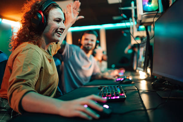 istock Gamers celebrating success with high five 2252279560