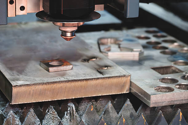 istock Industrial machine laser cutting metal sheets at work, industrial concept background 2252279747