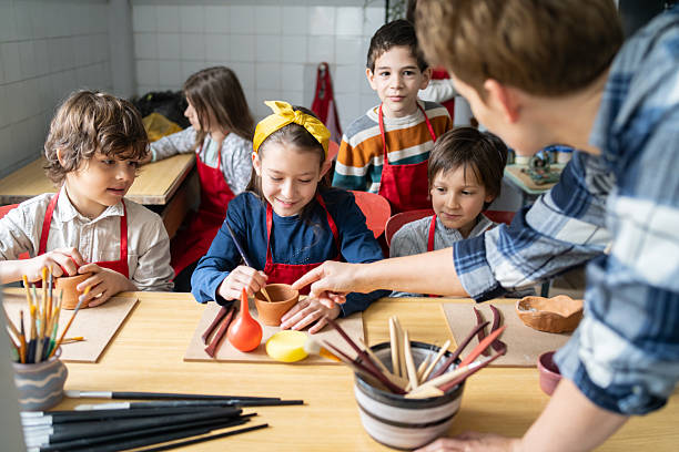 istock School children concentrating on clay modelling 2252280326