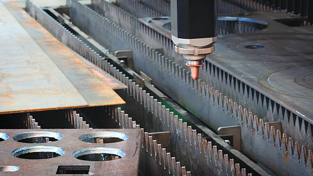 istock Industrial machine laser cutting metal sheets at work, industrial concept background 2252283135