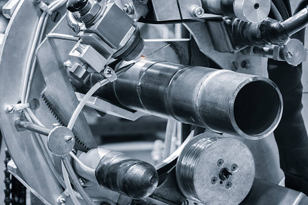 istock Metal pipe fixed in tank for cutting or welding with modern welding machine, industrial concept background 2252283778