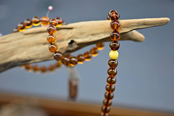 istock Amber Prayer Beads on Driftwood 2252285644