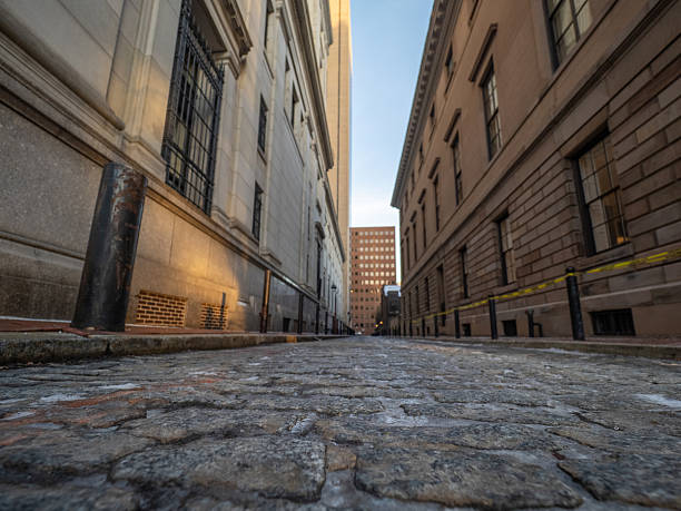 istock Cobblestone street reflects the evening light in an urban setting 2252286343