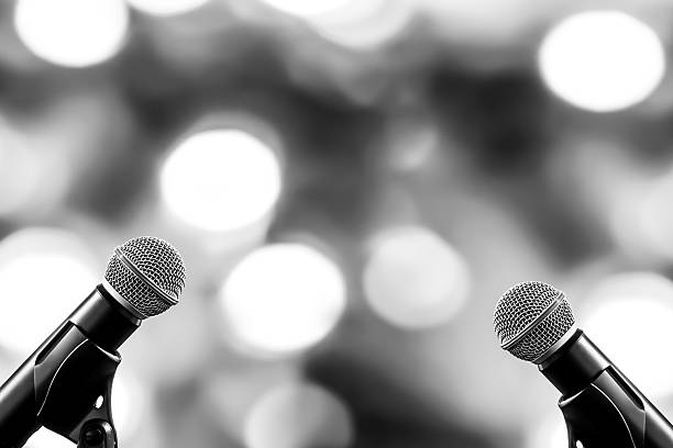 Microphones Public speaking background, Close up microphone on stand for speaker speech presentation stage performance or press conference backgrounds.