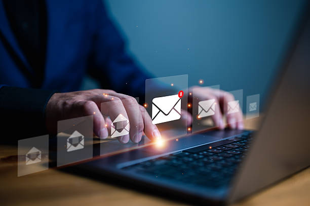 istock Professional accessing email inbox on laptop with multiple message icons indicating communication, notifications, and digital correspondence. 2252288479