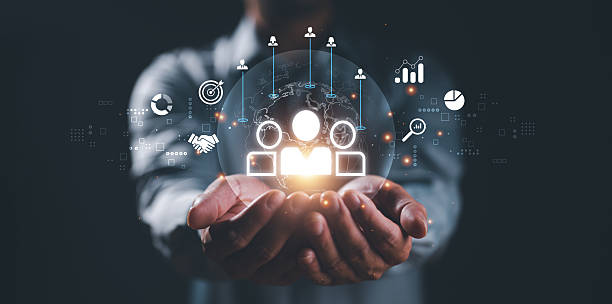 istock Business professional holding glowing globe with networking icons depicting collaboration, global connection, and partnership in the digital age. 2252288508