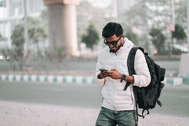 istock Young Traveler Using Smartphone During City Commute 2252295598