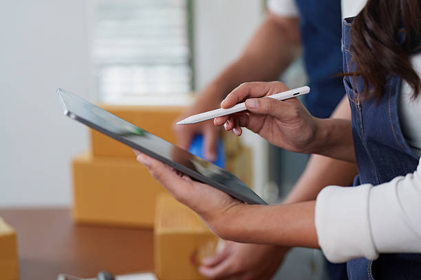 istock Digital Transformation. Professional woman using tablet for inventory management. 2252299453