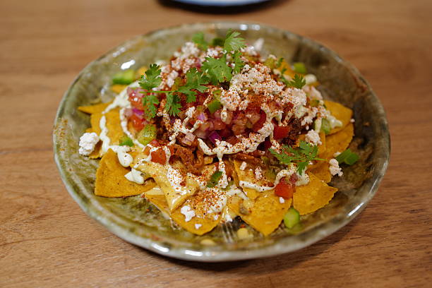 Close up plate of Nacho with salsa salad
