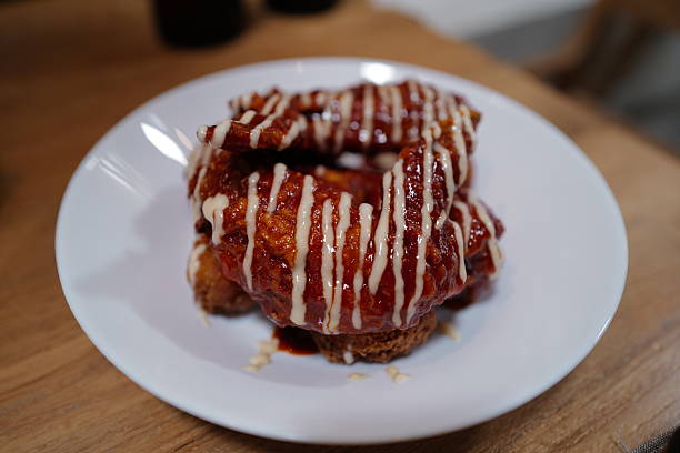 Close up battered and deep fried Buffalo chicken wings