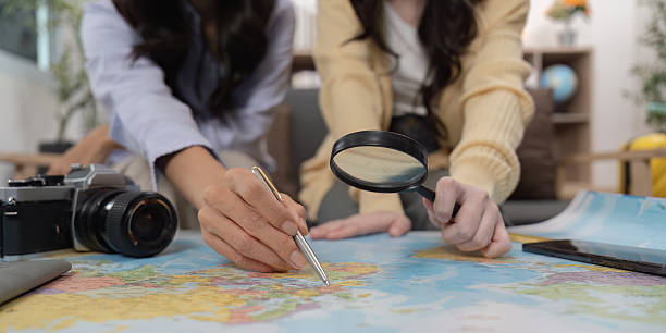 istock Travel Planning. Friends examining a map for their next adventure. 2252302452