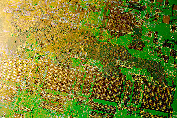 Close-up of circuit boards eroded by gold.
