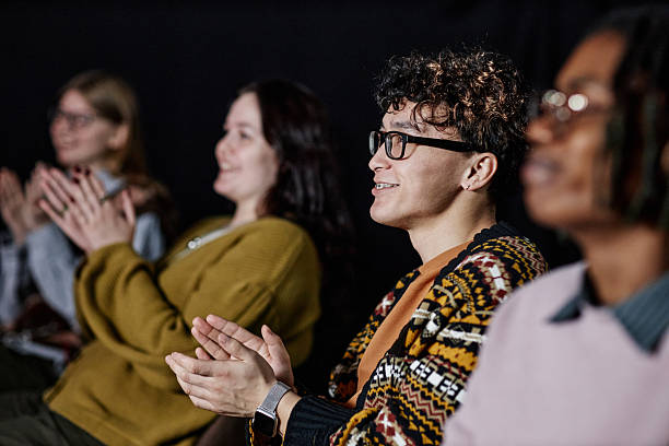 istock Diverse Group of Young Adults Applauding during Presentation in Auditorium 2252307387
