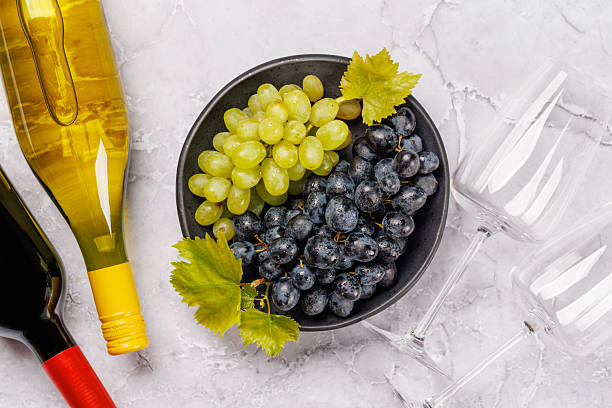 istock Wine bottles and fresh grapes 2252307866