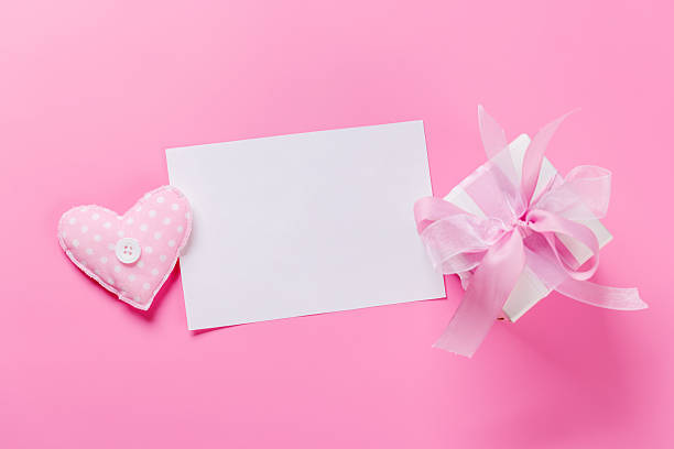 istock Gift box and card on pink background 2252308335