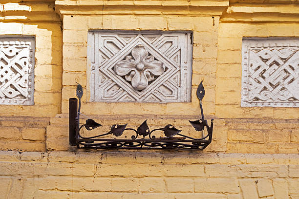 istock Decorative plant-based architectural plaster rosette on the wall of a house 2252308349