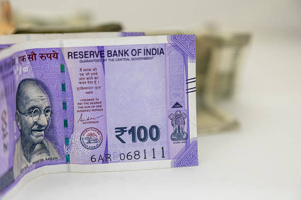 istock Indian Rupee 100 Currency Notes with Fanned Cash Background 2252308873