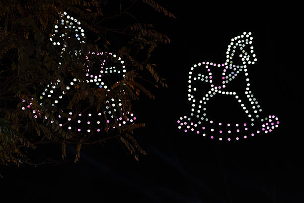 Drone Light Show Creating a Rocking Horse Silhouette during a Nighttime Technology and Holiday Event