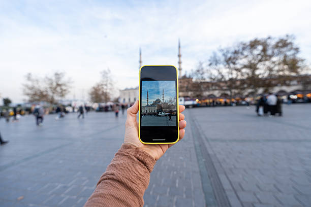 istock Person holding smartphone capturing mosque image in Istanbul 2252316038