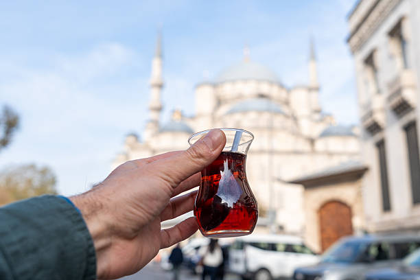 istock Hand holding turkish tea with historical Istanbul mosque 2252316668