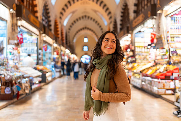 istock Smiling woman exploring historic grand bazaar in istanbul 2252316669