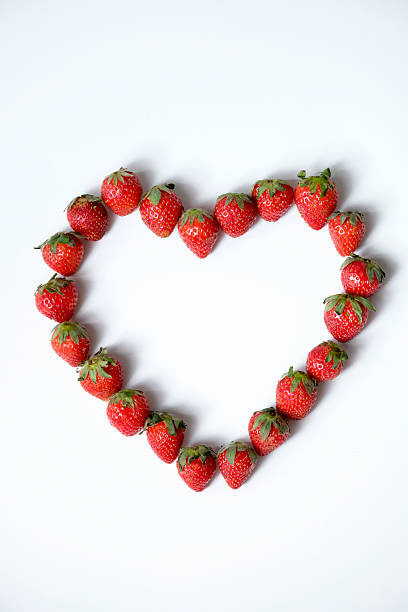 istock Strawberry in heart shape isolated on white background 2252317352