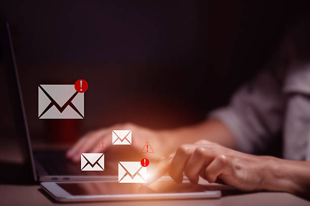 istock person typing on laptop receives scam notification, illustrating cybersecurity risk and data breach threat, Spam mail pop-up warning. E-mail inbox with spam virus message, Trash and junk mail, scam. 2252317807