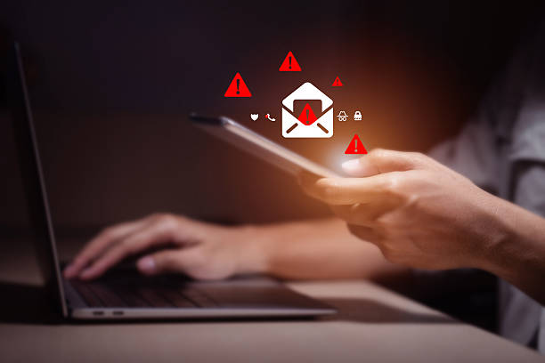 istock person typing on laptop receives scam notification, illustrating cybersecurity risk and data breach threat, Spam mail pop-up warning. E-mail inbox with spam virus message, Trash and junk mail, scam. 2252317819