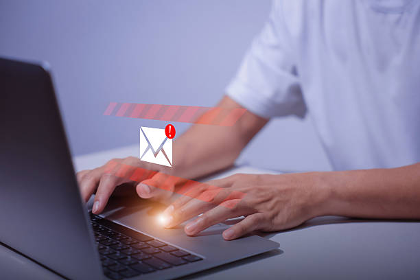 istock person typing on laptop receives scam notification, illustrating cybersecurity risk and data breach threat, Spam mail pop-up warning. E-mail inbox with spam virus message, Trash and junk mail, scam. 2252317838