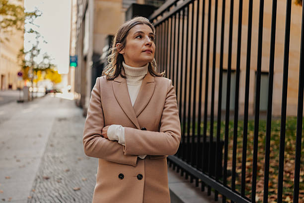 istock Woman walking in Berlin, dressed elegantly during autumn in a city setting with historic architecture 2252320437
