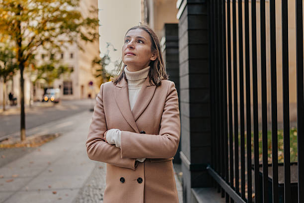 istock Young adult enjoys a stroll through Berlin's charming streets in autumn sunlight 2252321362