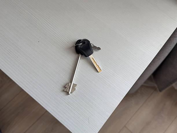 istock Keys rest on a white table beside a window in a home setting with natural light 2252322672