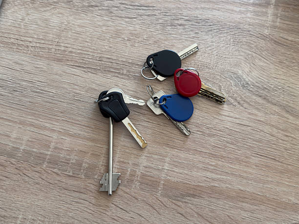 istock Keys in different colors rest on a wooden surface in a simple layout for easy viewing 2252322674