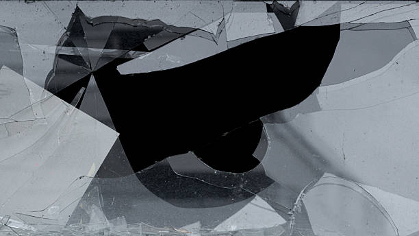 istock Broken glass surface with cracks and shattered fragments 2252325697