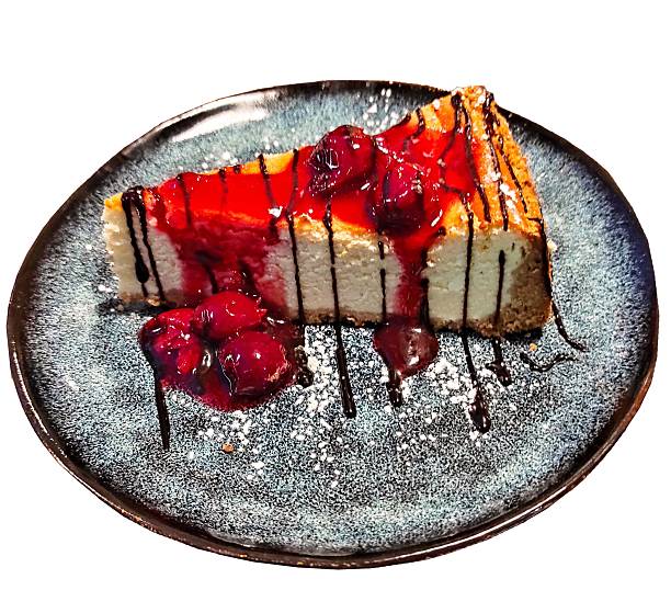 istock Cheesecake Slice with Fresh Raspberries and Chocolate Drizzle 2252327756