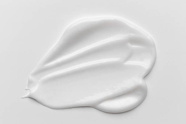 istock White cosmetic cream smear with smooth texture and soft folds. 2252329518