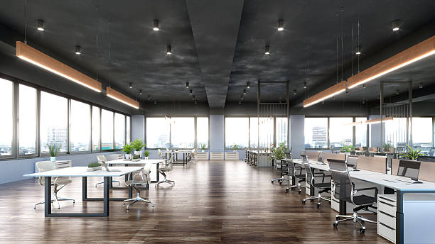 istock A modern open-space office interior featuring large windows, wooden flooring, contemporary desks, ergonomic office chairs, and stylish hanging lights. 3d illustration 2252330257