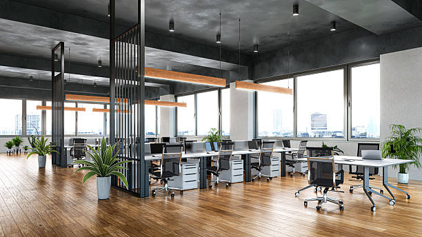 istock A modern open-space office interior featuring large windows, wooden flooring, contemporary desks, ergonomic office chairs, and stylish hanging lights. 3d illustration 2252330424