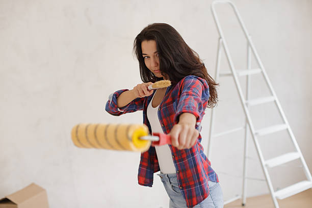istock Funny DIY Karate Pose With Paint Roller And Brush During Home Makeover 2252338591