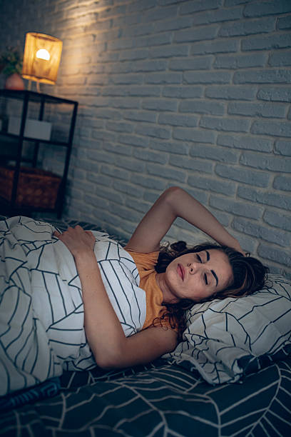 istock Exhausted woman resting in bed, unable to fall asleep 2252339210
