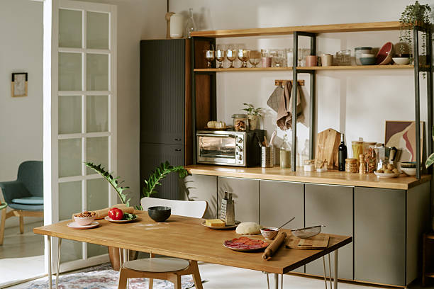 istock Modern Kitchen Interior Featuring Wooden Table with Food Ingredients Displayed 2252340234