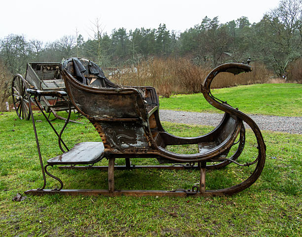 An old sled in a snowdrift. Old children's sleds in the snow